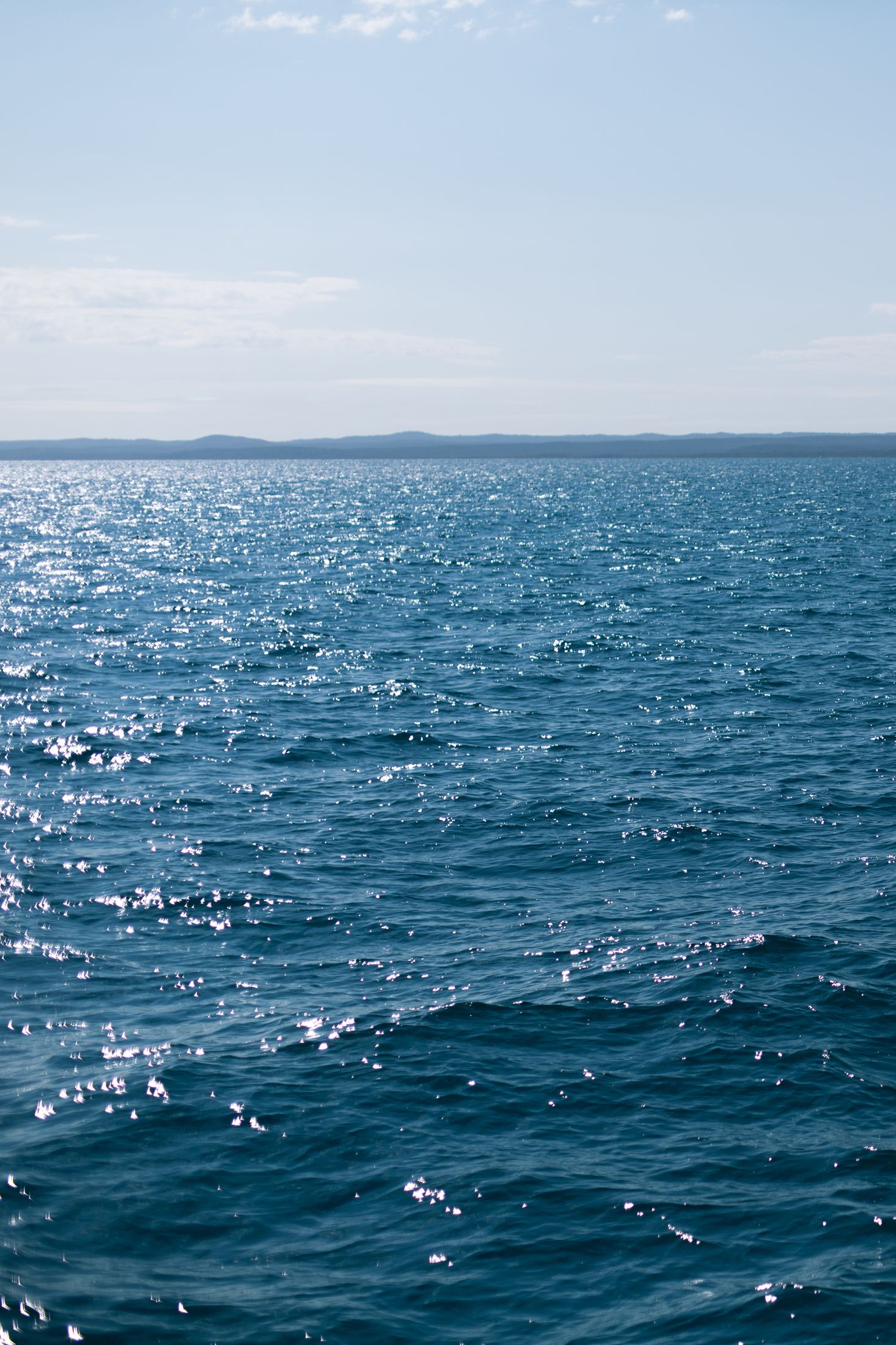 Calm blue ocean under clear sky.